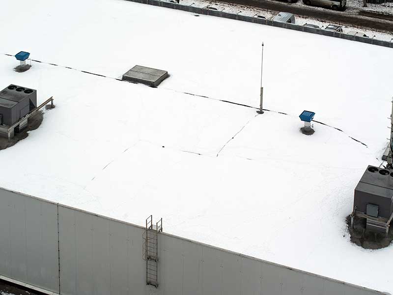 Top view of a white, flat commercial roof